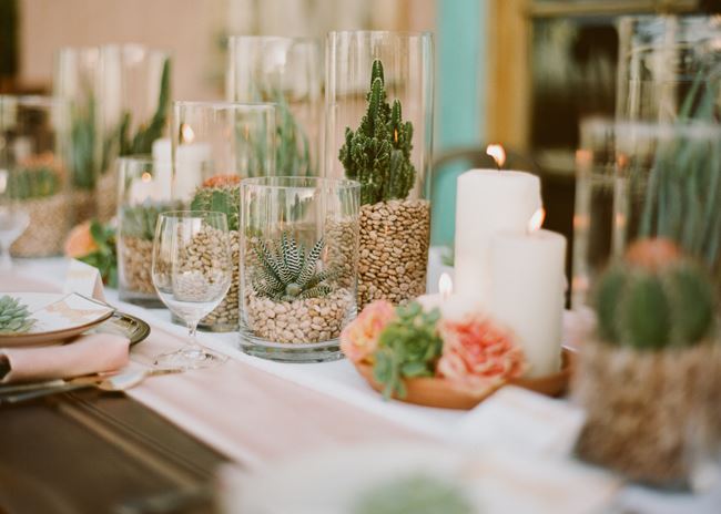 Succulents and candles create a table runner from Green Wedding Shoes