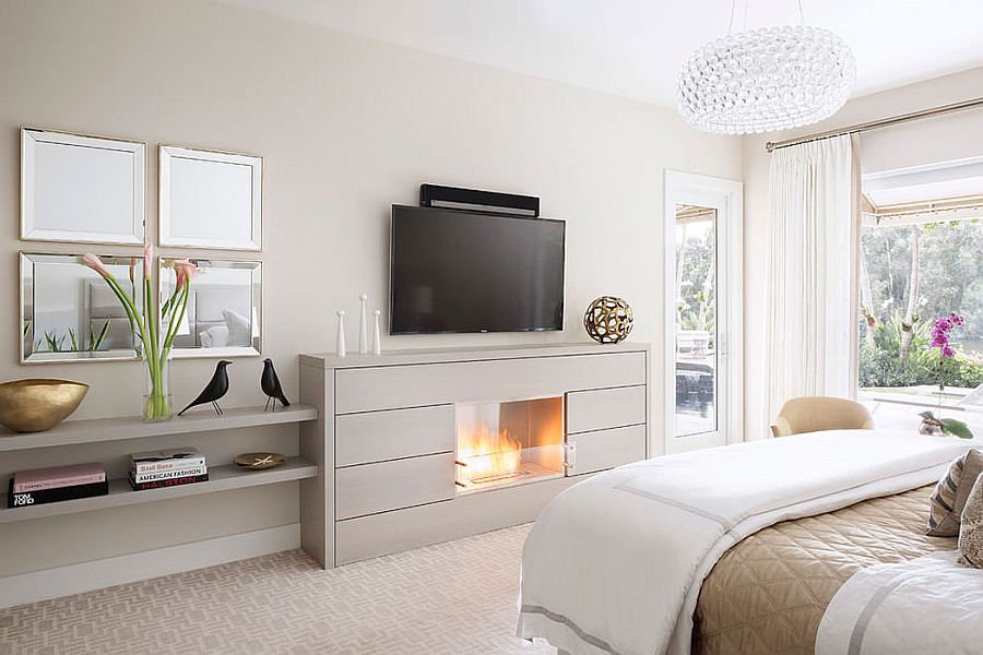 TV above the fireplace in the bedroom