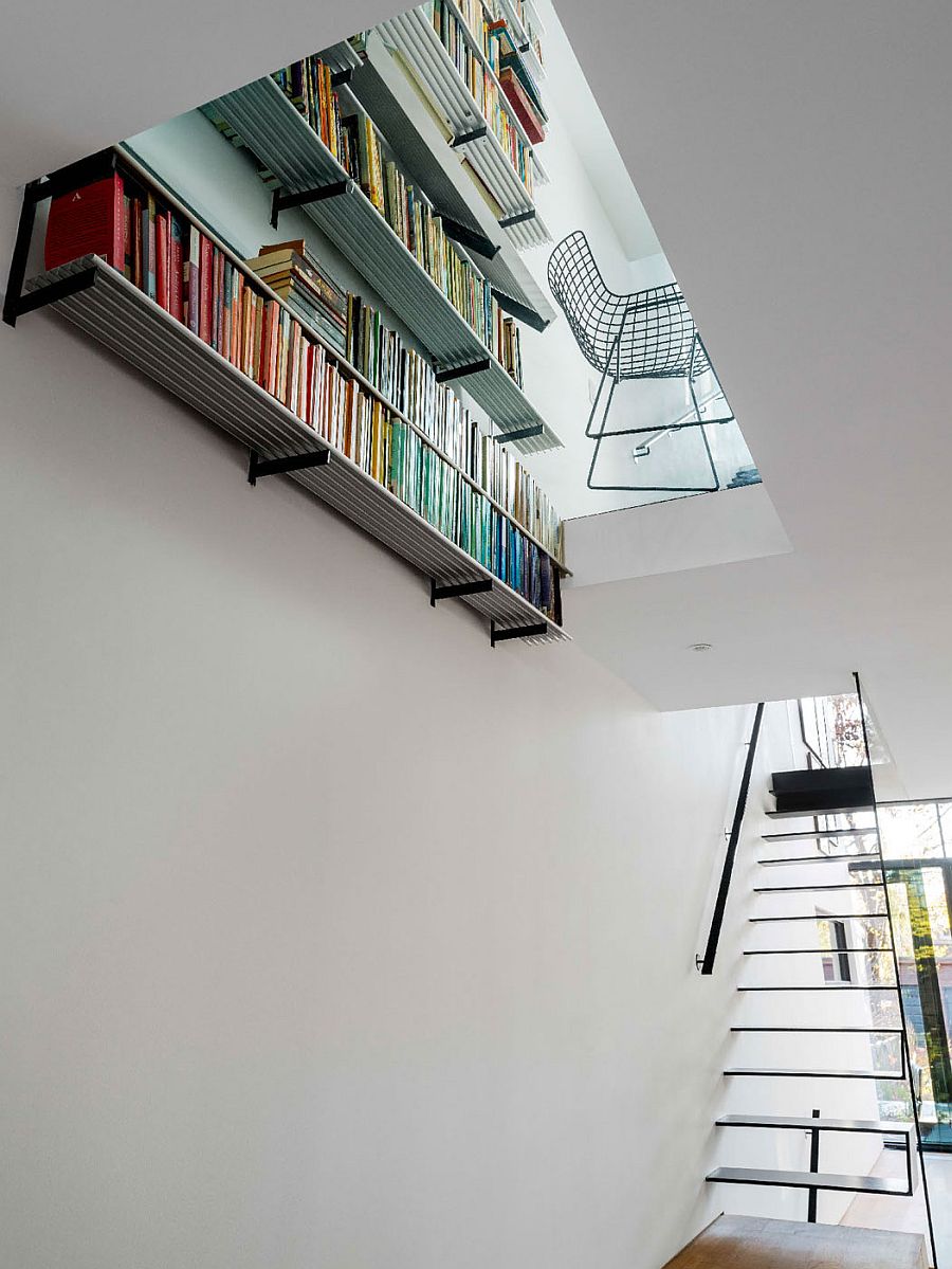 Unique home library on the top level adds color to the space