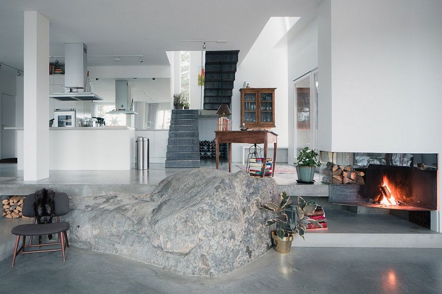 View of the kitchen and the staircase from the living area