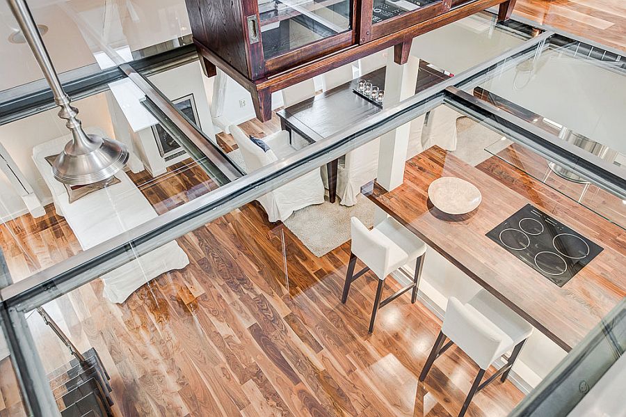 View of the lower level through the glass floor of the top level