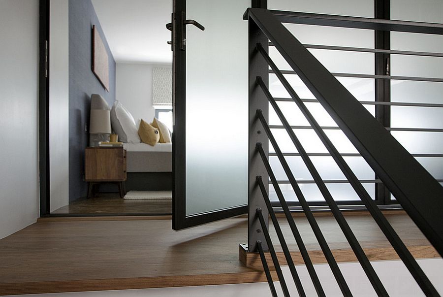 Walnut staircase leads to the master bedroom on the top level