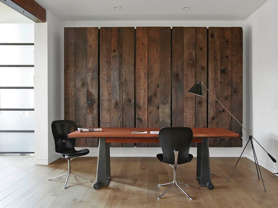 Wooden panels conceal a large Murphy bed behind them in this contemporary home office