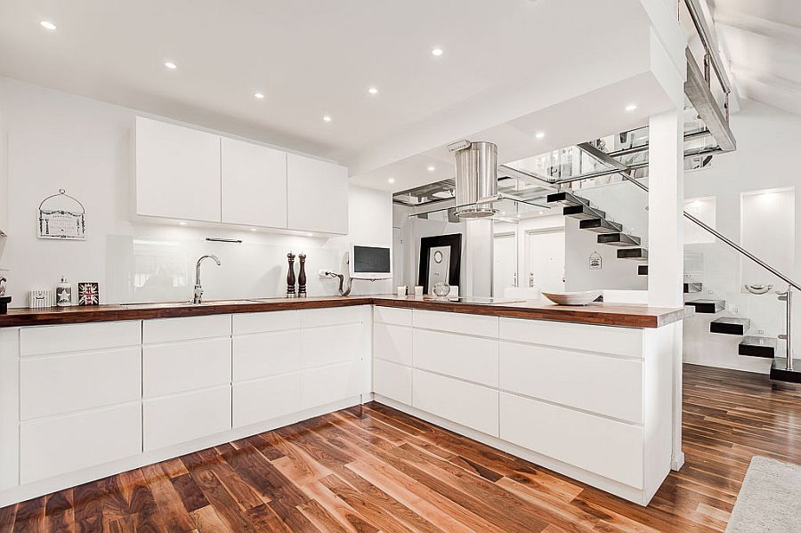 Wooden worktops in the kitchen offer elegant visual contrast