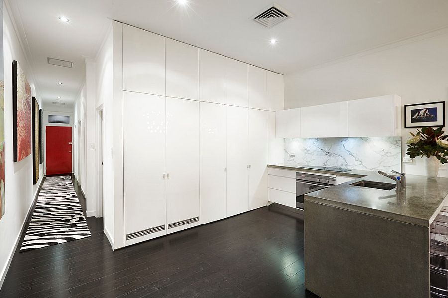 All white kitchen design with a stylish marble backsplash