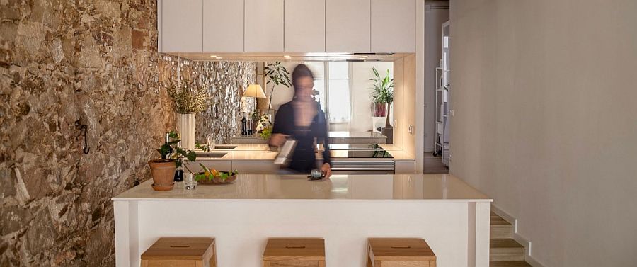 All-white kitchen in renovated nineteenth century apartment in Barcelona