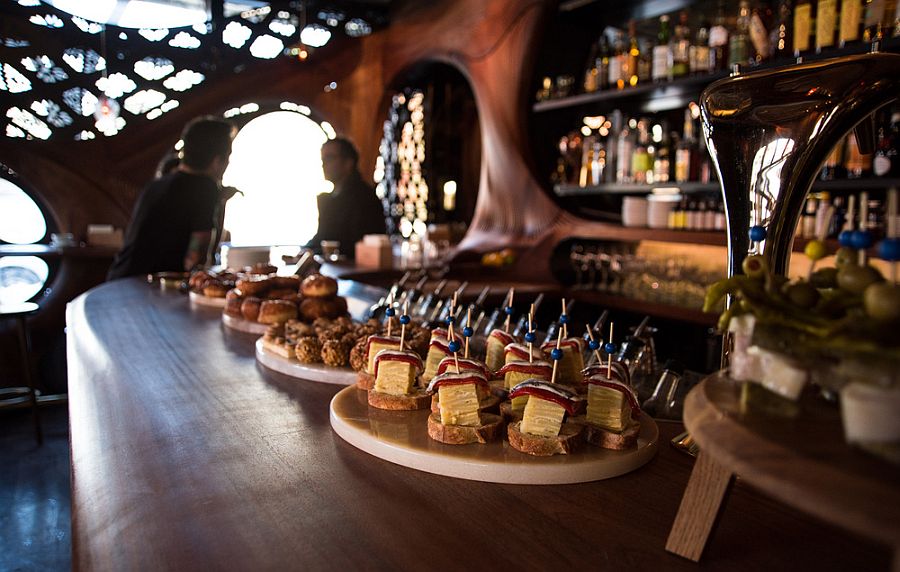 Bar Raval Toronto steals the show with its CNC'd mahogany interior