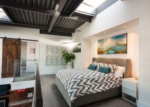Bedroom-on-the-top-level-of-the-loft-overloooking-the-living-area-below-217x155