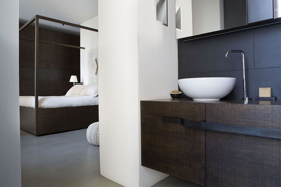 Black and white bathroom complements the color scheme of the bedroom