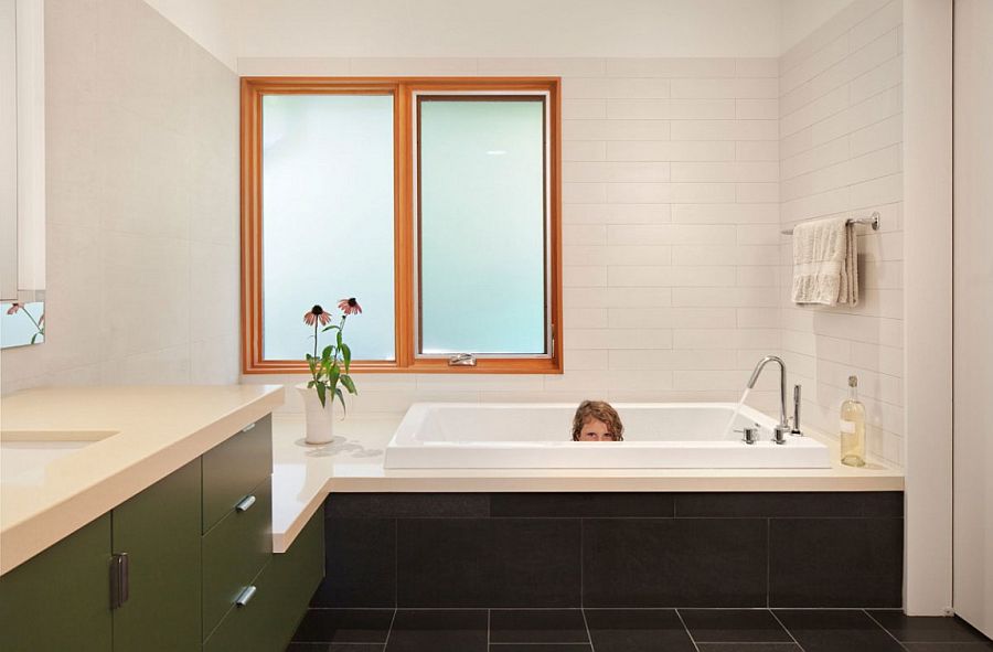 Black and white bathroom design with hints of green