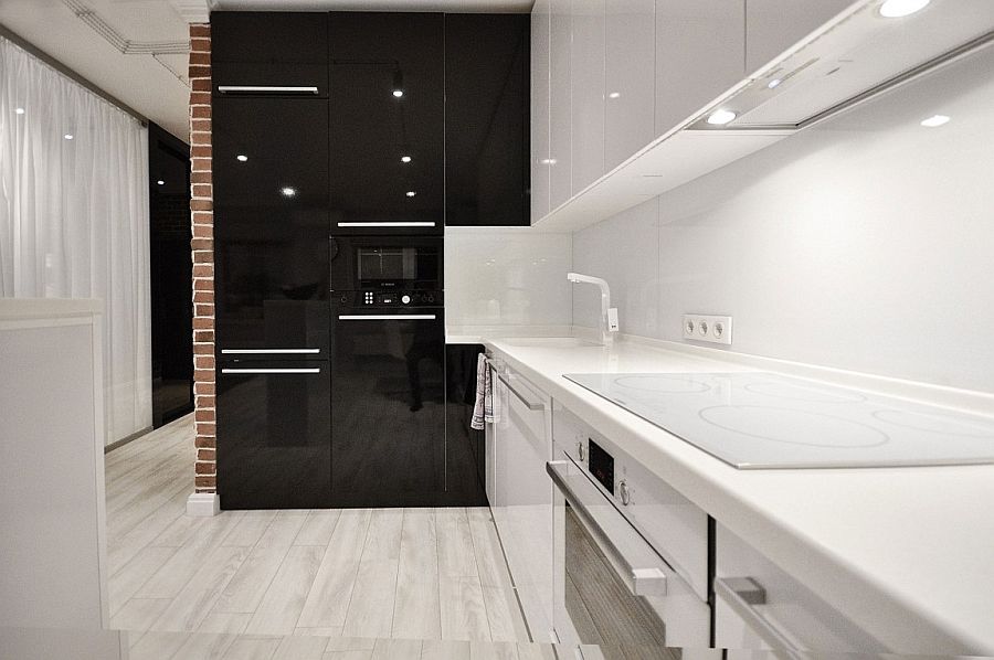 Black and white kitchen design with glossy finishes