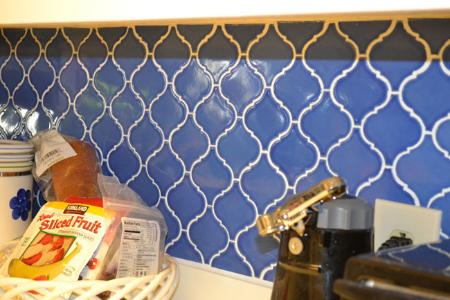 Blue patterned tile backsplash