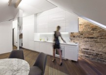 Brick-wall-adds-an-interesting-visual-to-the-modern-attic-apartment-217x155
