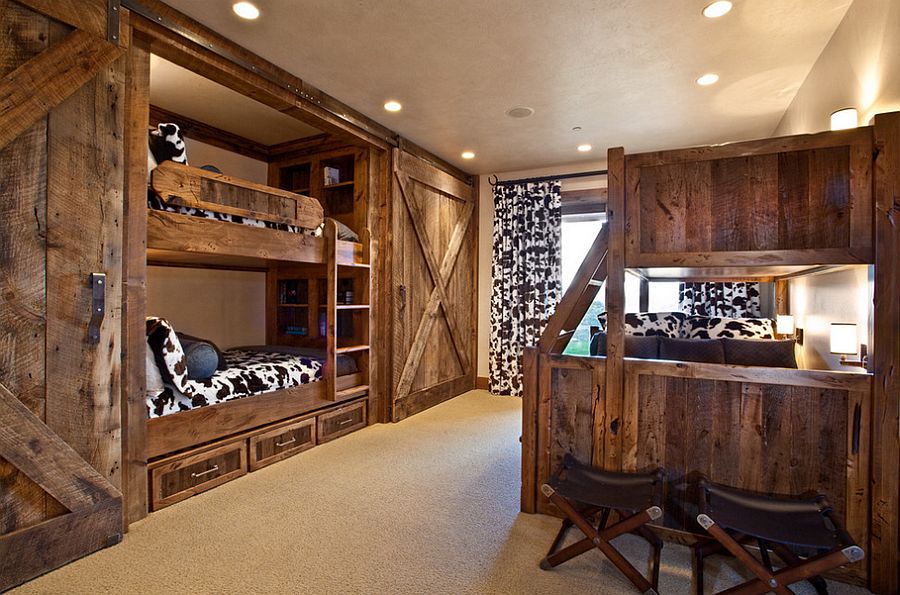 Bunk beds and sliding barn doors in the rustic bedroom [Design: MHR Design]