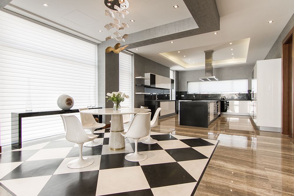 Checkered tiles separate the dining space from the kitchen