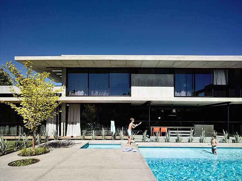 Concrete connects the interior with the pool deck outside texturally