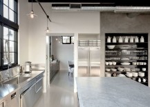 Concrete-steel-and-glass-shape-the-large-kitchen-of-the-house-217x155