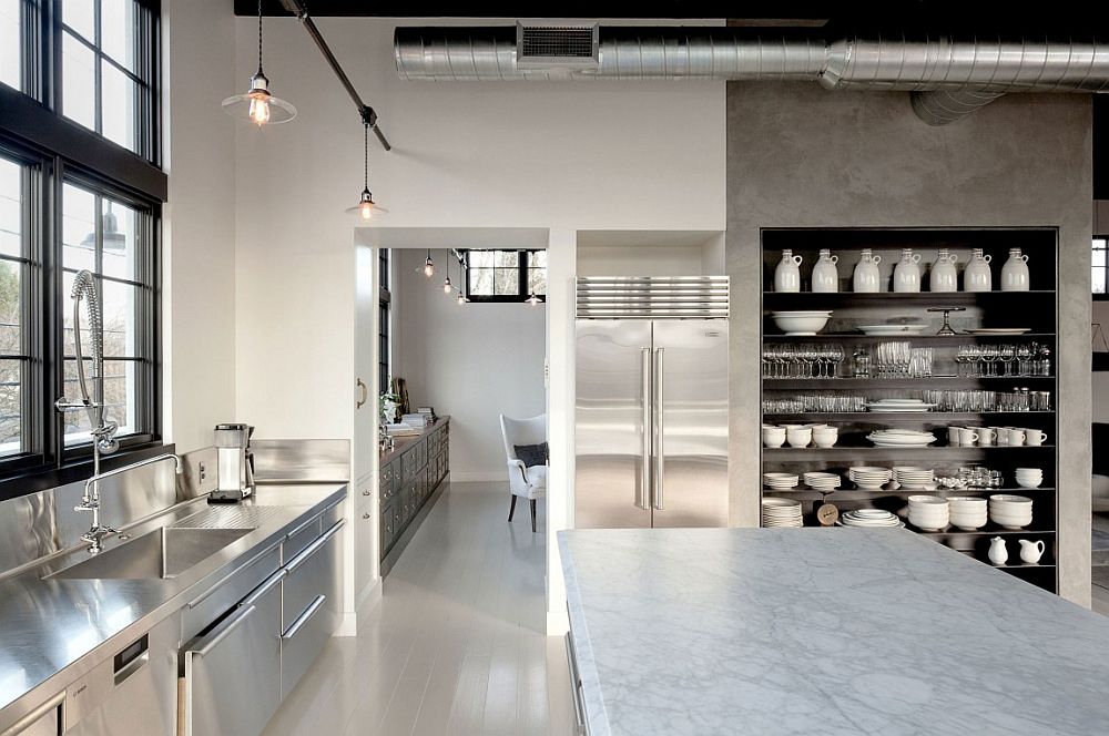 Concrete, steel and glass shape the large kitchen of the house