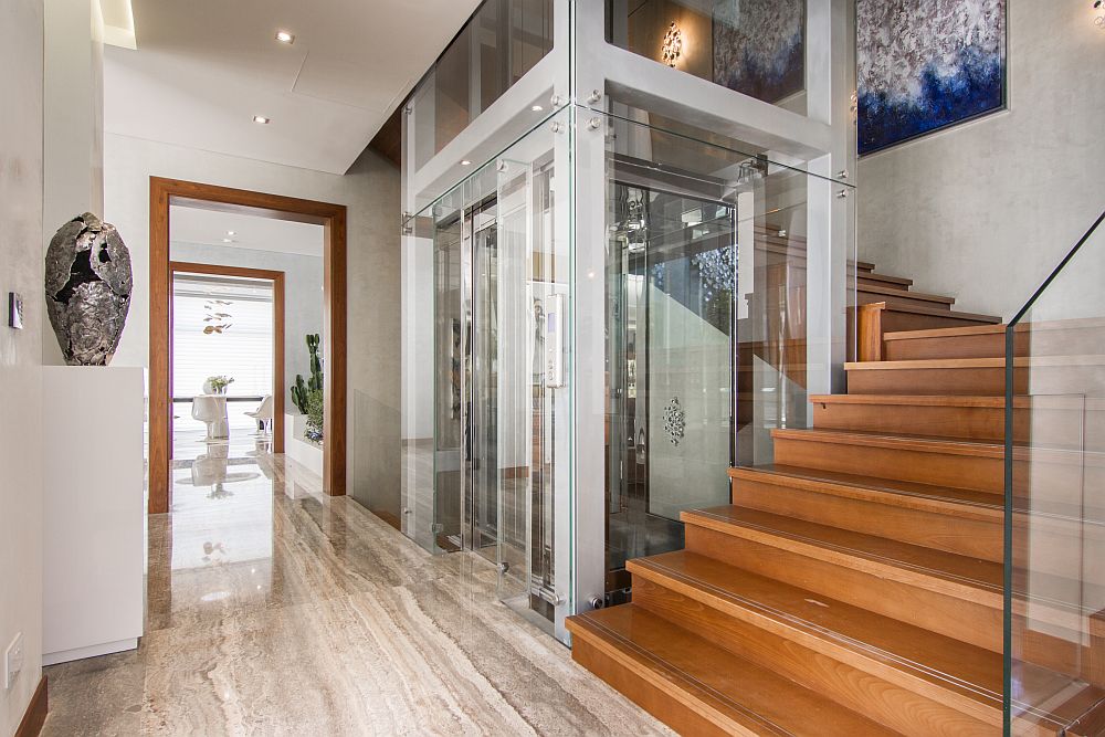 Contemporary elevator connects the various levels of the home