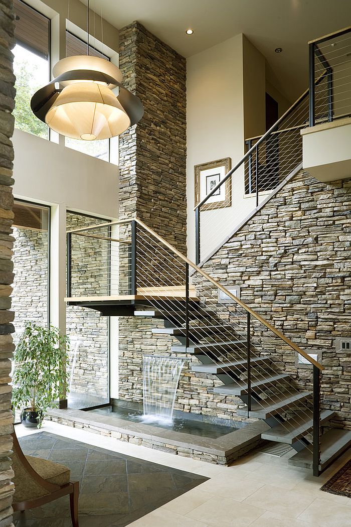 Contemporary staircase with a water feature underneath [Design: Alan Mascord Design Associates]
