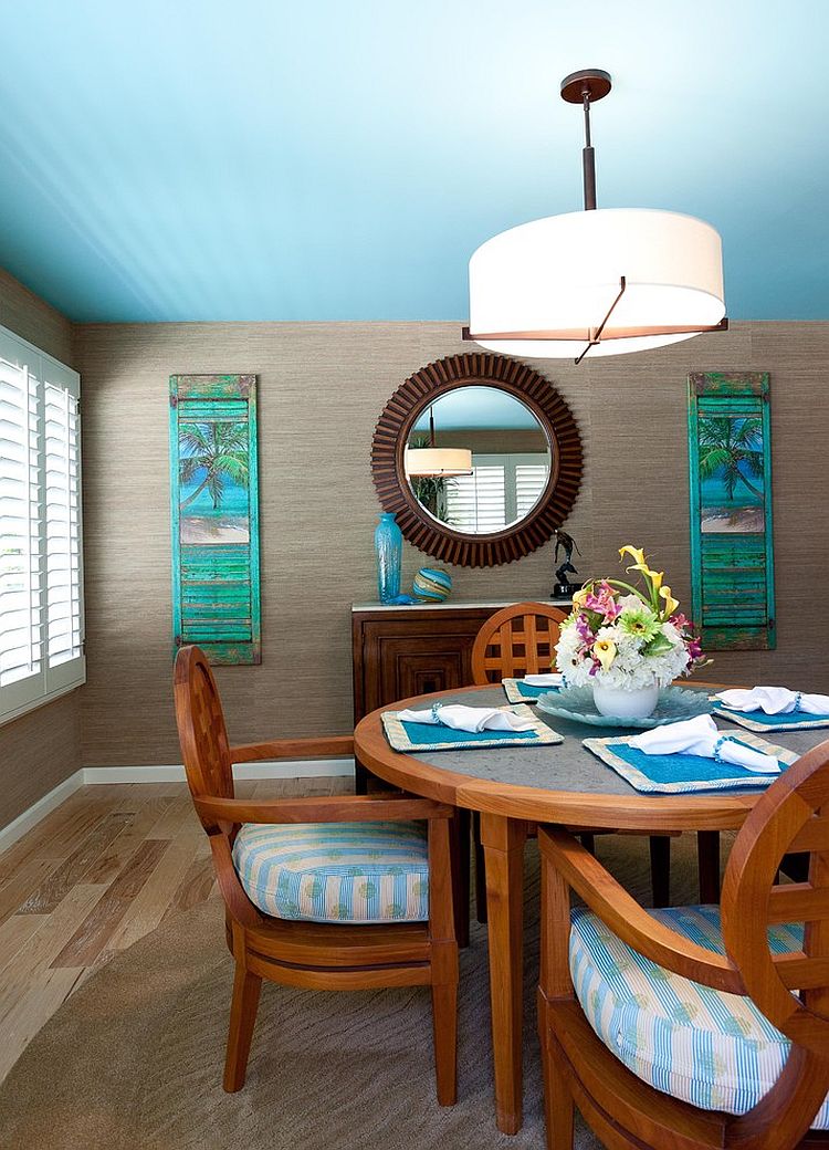 Dashing tropical style dining room with blue ceiling [Design: Karen Grace Interiors]