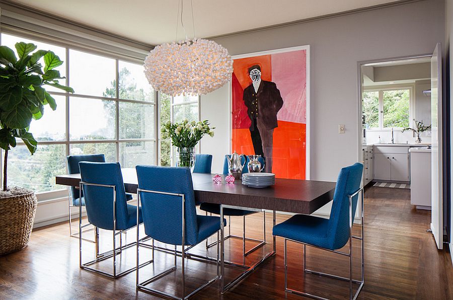 Dining table chairs bring the blue into this lovely contemporary setting