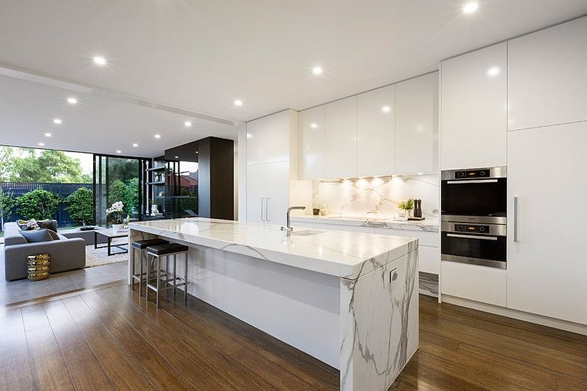 Dramatic marble island bench is the showstopper in the white kitchen