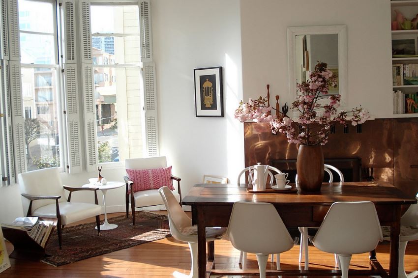 Eclectic dining room with pink blossoms