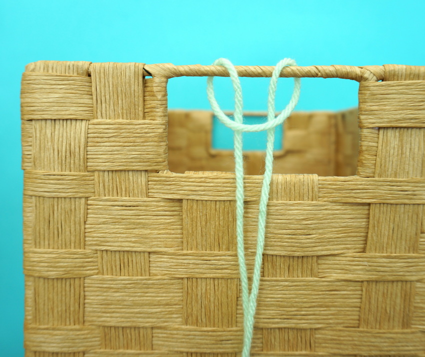 Embellish your gift basket handles with yarn