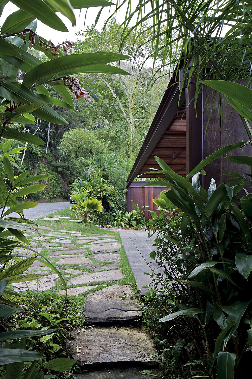 Entrance to the private house is concealed by natural greenery