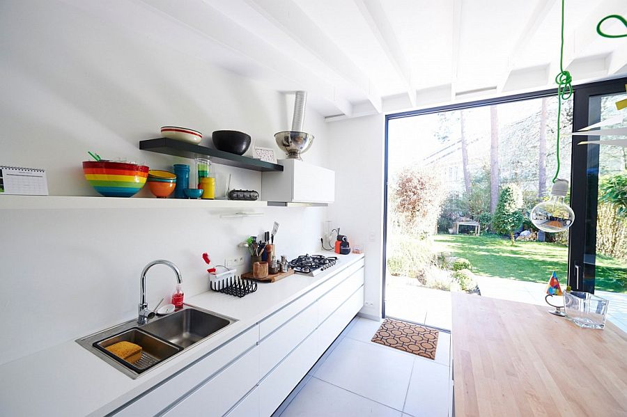 Eronomic kitchen workstation design with floating shelves above