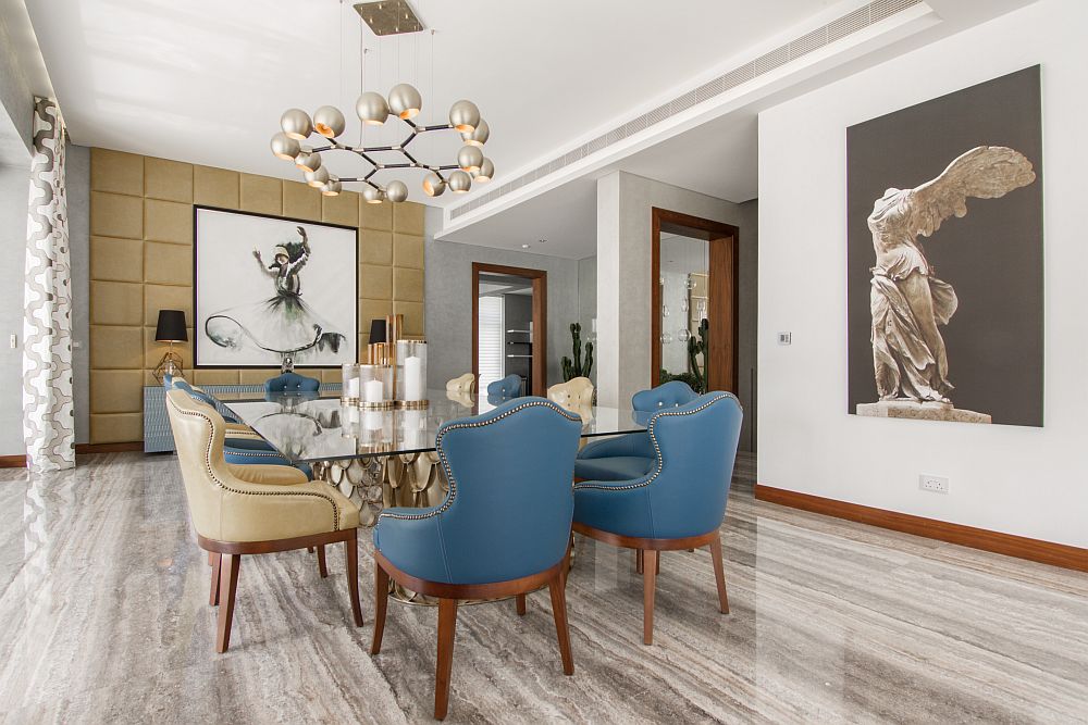 Exclusive dining area with brilliant wall art and custom lighting fixtures