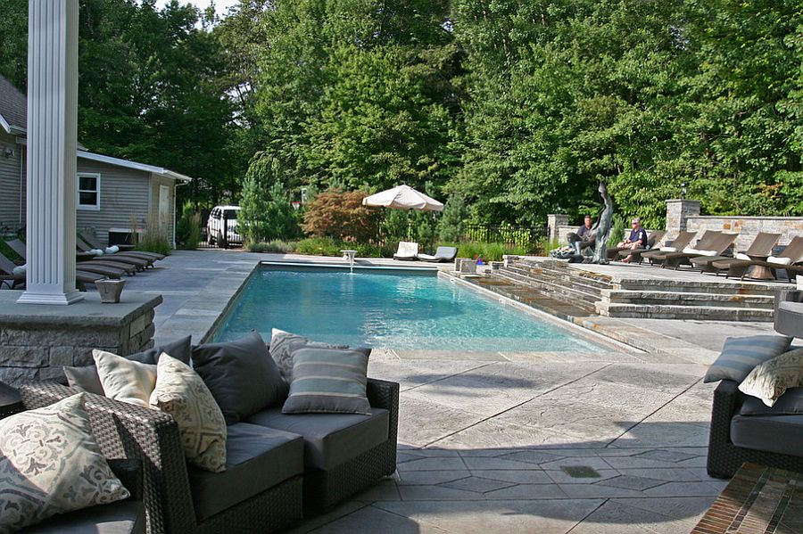 Expansive pool area with a stamped concrete deck [Design: L. M. Scofield Company]