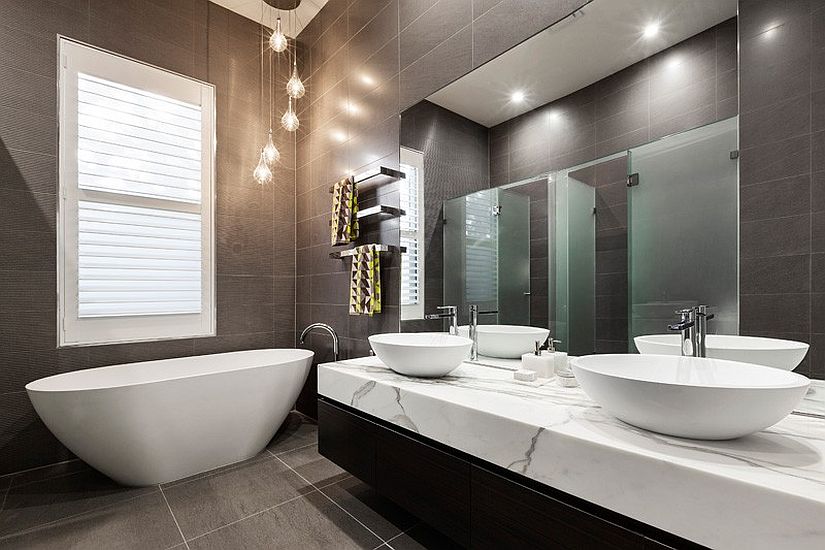 Exquisite contemporary bathroom in gray with standalone bathtub in white