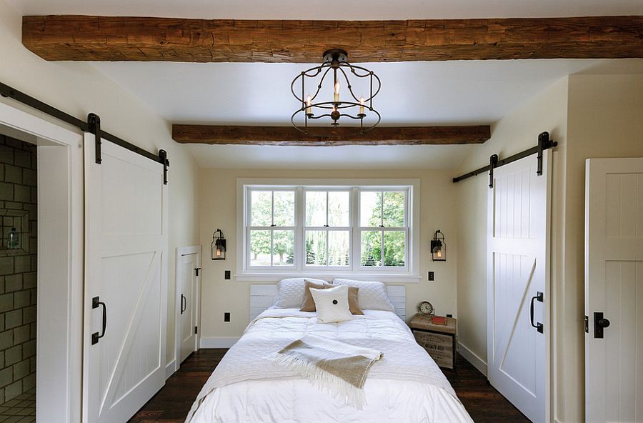 Exquisite use of sliding barn doors in the bedroom