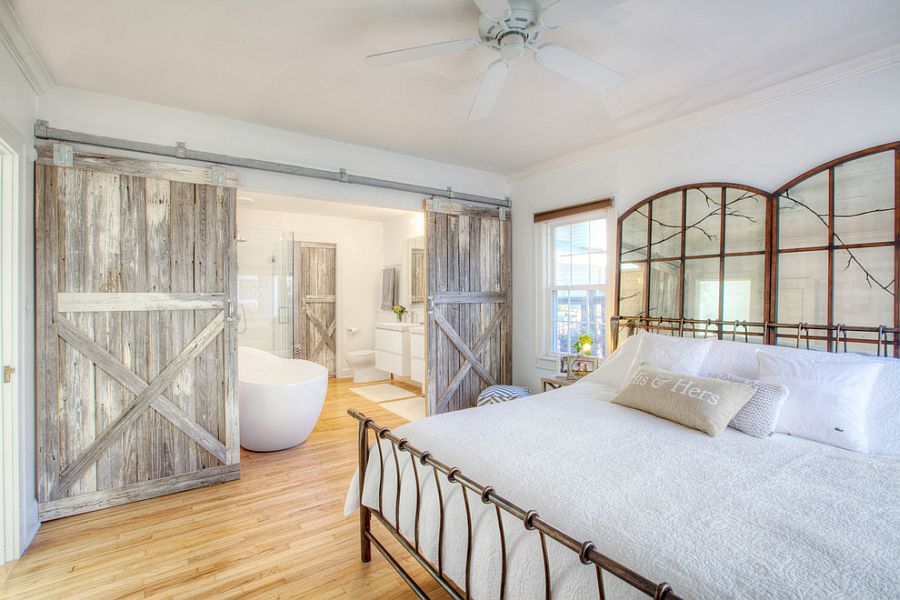 Farmhouse style bedroom with reclaimed wood barn doors [Design: HAUS]