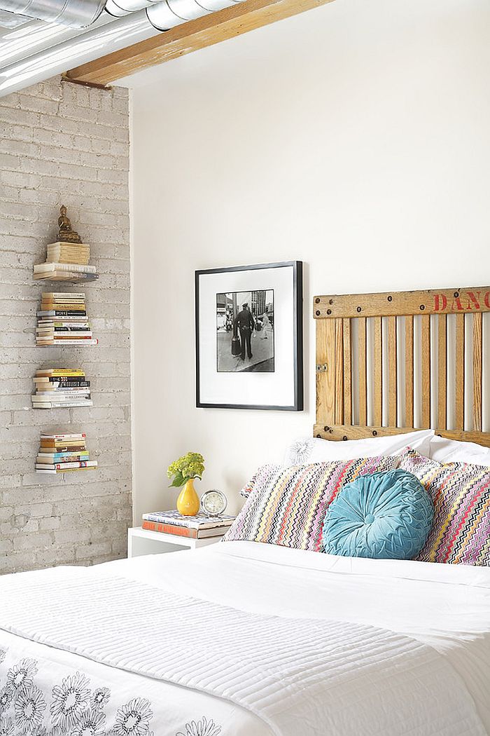 Freight elevator door turned into a smart headboard in the industrial bedroom