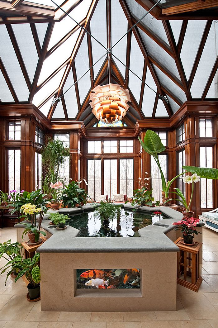 Gorgeous Koi Pond becomes the focal point of the grand sunroom [Design: Chase Building Group]