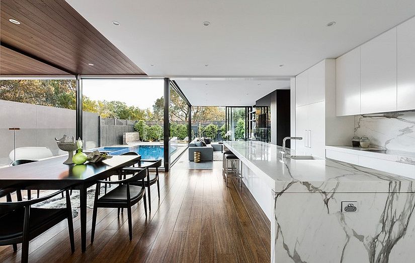 Gorgeous marble kitchen island defines the elegant open kitchen