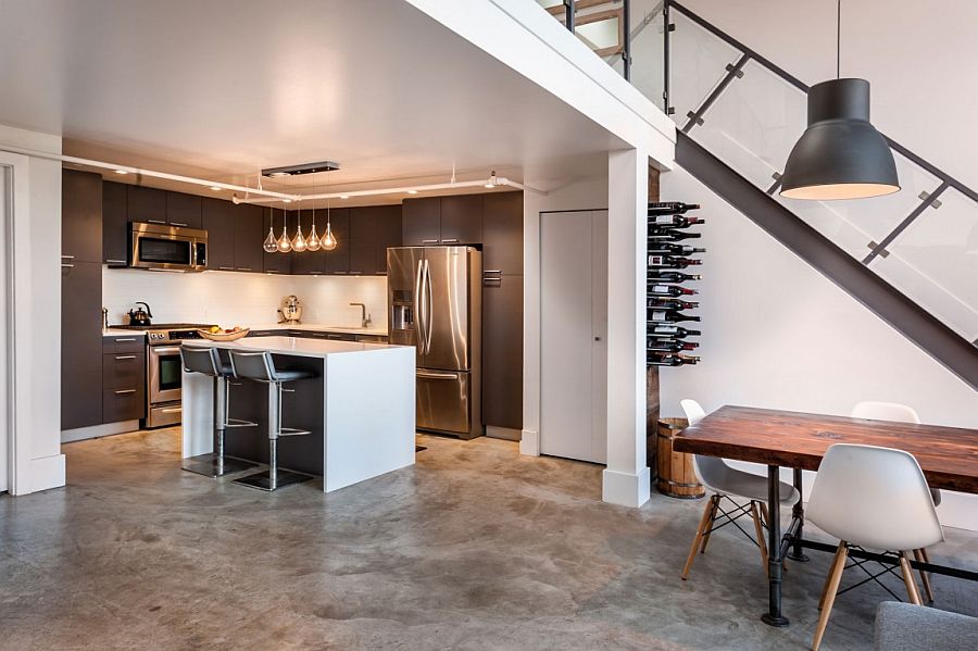 Gray and white shape the home even as a small wine rack hides below the staircase