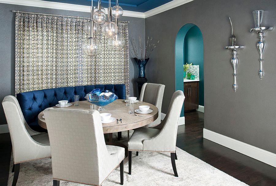 Gray dining room with custom designed blue banquet and ceiling