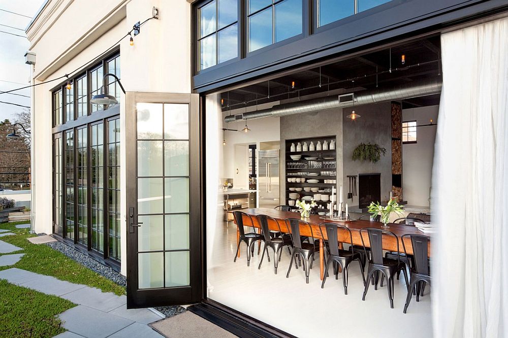 Industrial appeal of the home is accentuated by the large, framed glass doors