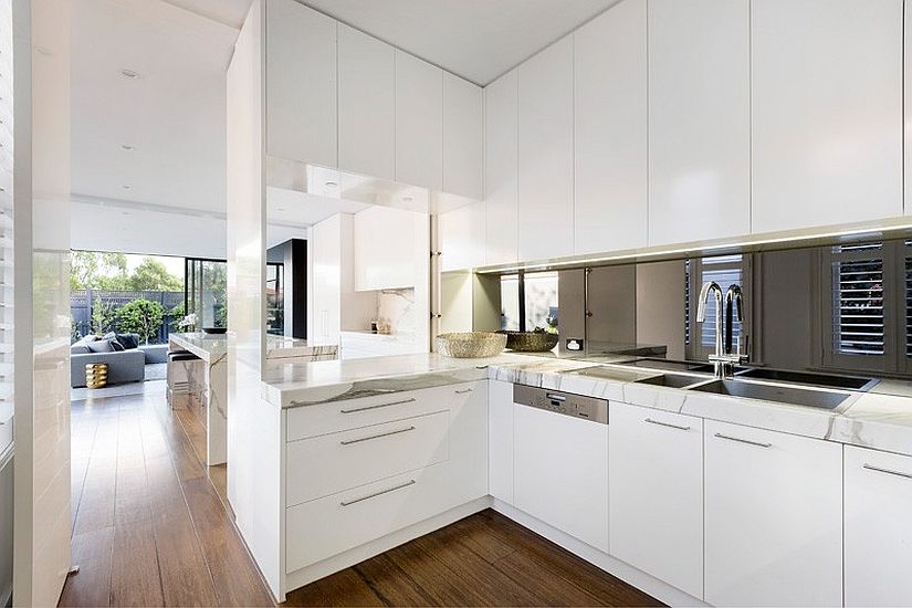 Kitchen space from the inside extends to the contemporary addition outside
