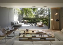Large-Glass-Wall-Overlooking-Outdoor-Oasis-217x155
