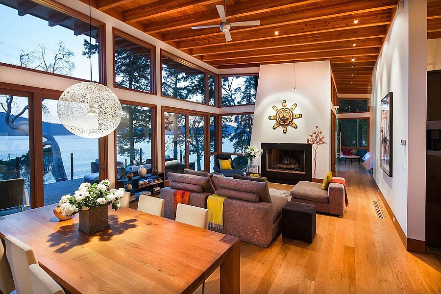 Large glass windows of the oceanside retreat offer unabated views