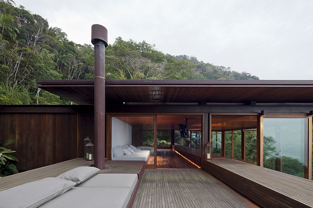 Large wooden deck and open living space defines the lavish Sao Paulo house