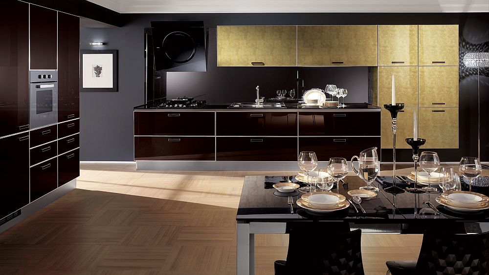 Leaf gold doors and glossy glass surfaces transform the mundane kitchen into a masterpiece