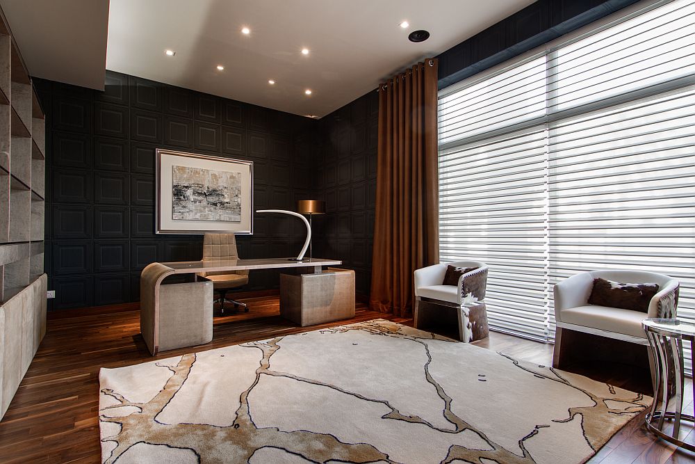 Lovely home office with dark walls and dark brown hues