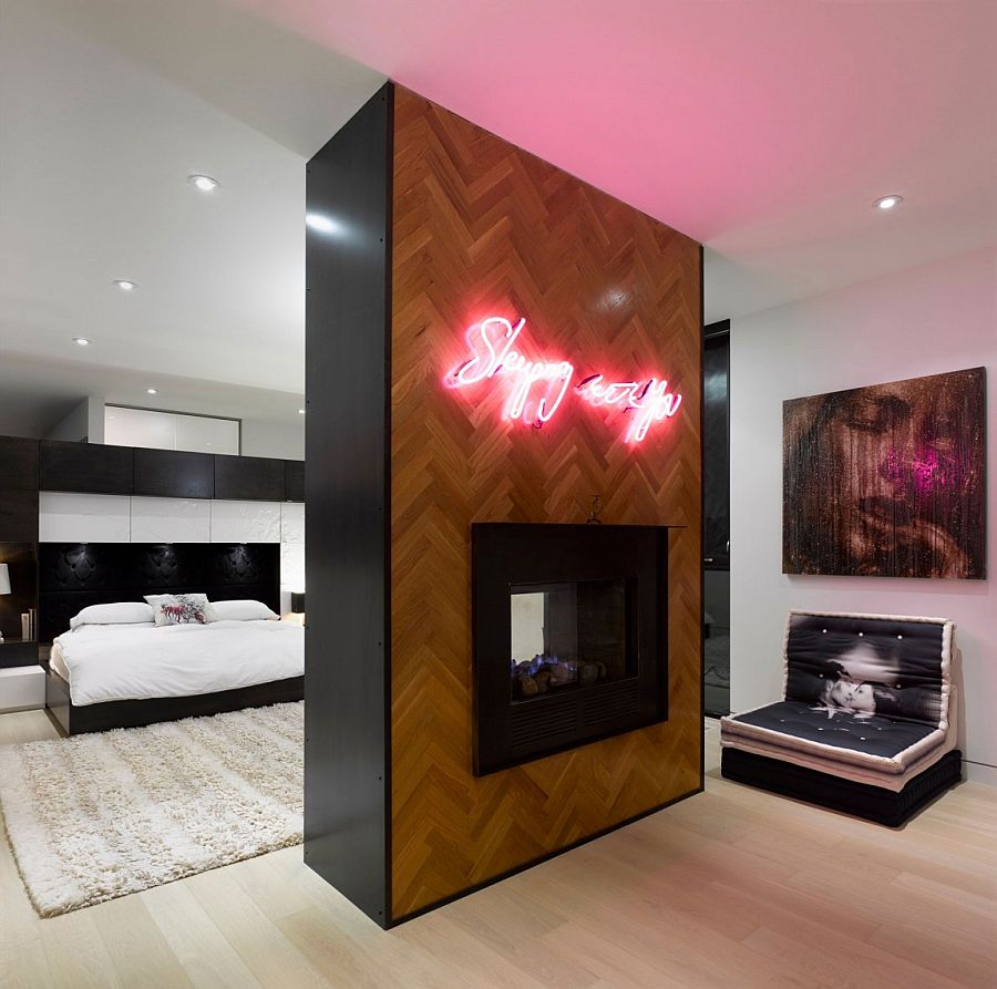 Luxurious master bedroom with neon wall addition and two-sided fireplace