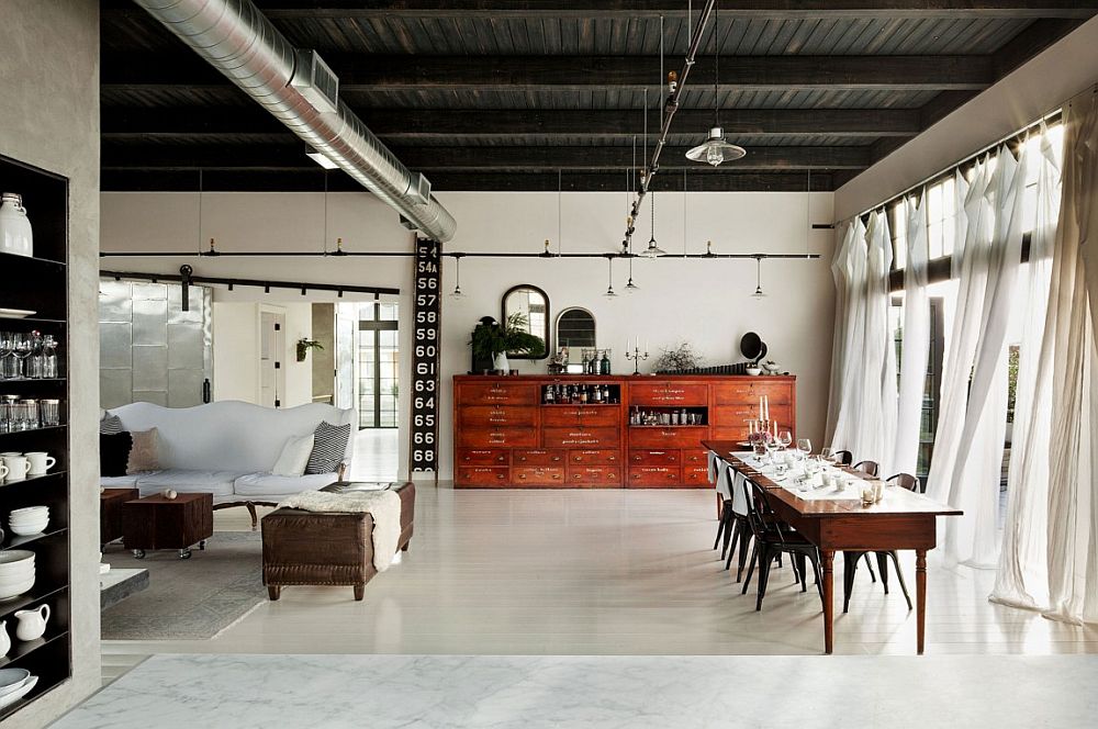 Old sprinkler-styled track lighting inside the spacious loft home